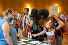 Teachers registering for a conference