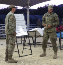 Cadet Vernon Marsh (right) gives a block of instruction at the Fall Field Training Exercise (FTX)