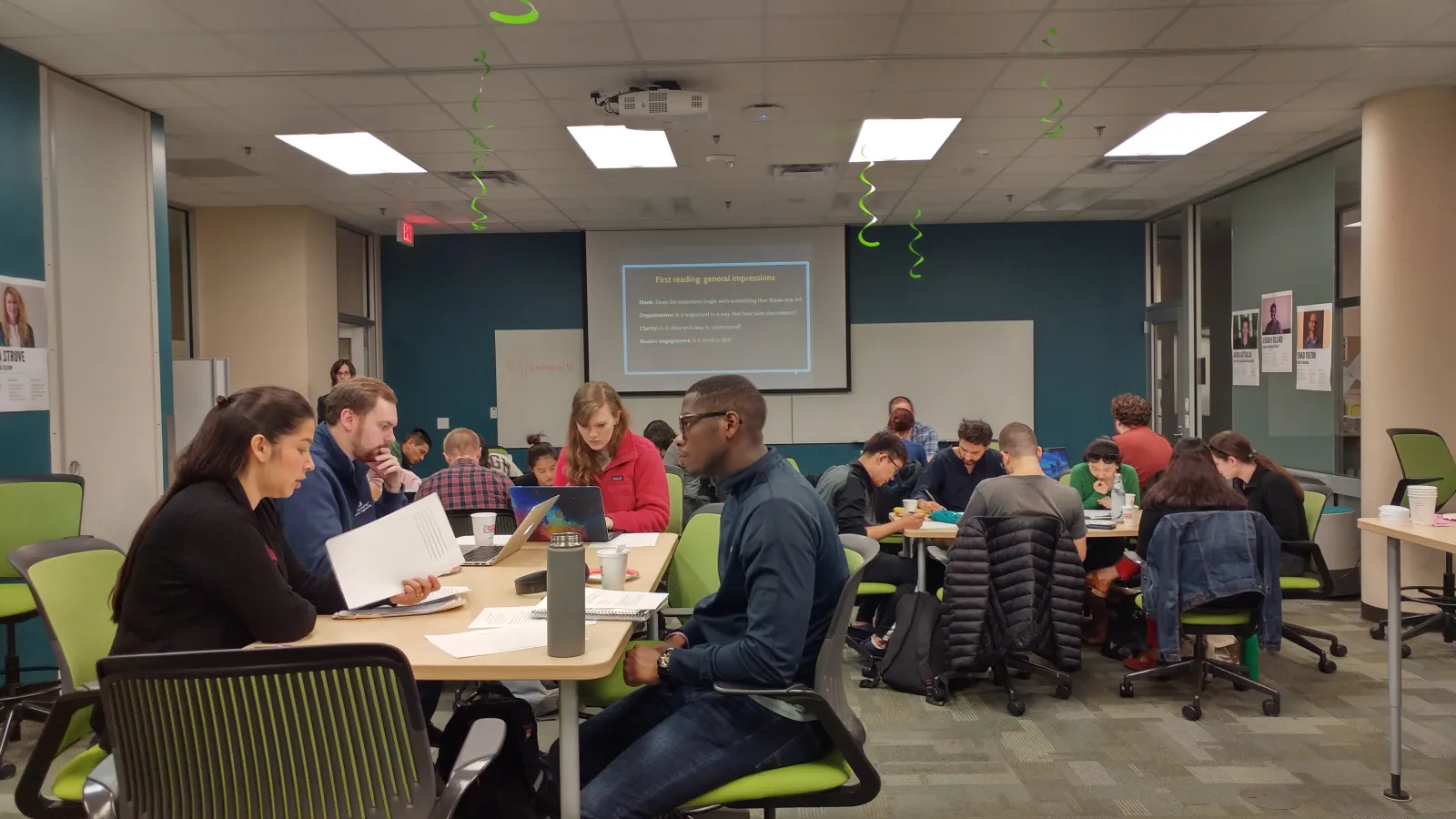 People are reading and writing in a workshop