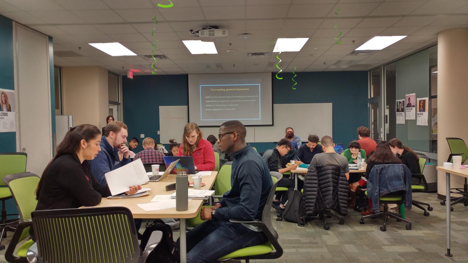 People are reading and writing in a workshop