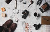 map on table with camera, shoes, magnifying glass, pipe, and other items spreadout over it... gearing up for an adventure