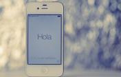 cell phone with the word hola on the screen