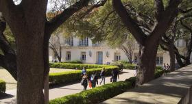 main-mall-through-trees-with-students-and-battle-hall-