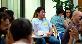 Group of multiethnic faculty smiling and working in groups 