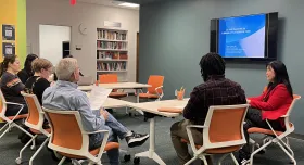 Group of diverse people discussing AI