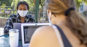 Students working outside with masks