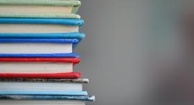 A stack of multicolored books