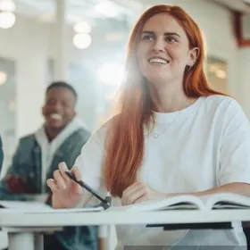 Student actively listening to an off-screen speaker