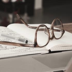 Glasses and book