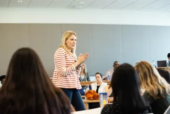 Female professor teaching class