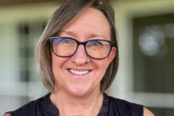 Woman with shoulderlength brown hair and glasses. Dr. Michelle Gaston headshot