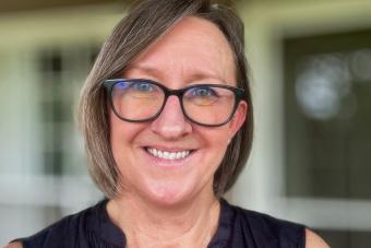 Woman with shoulderlength brown hair and glasses. Dr. Michelle Gaston headshot
