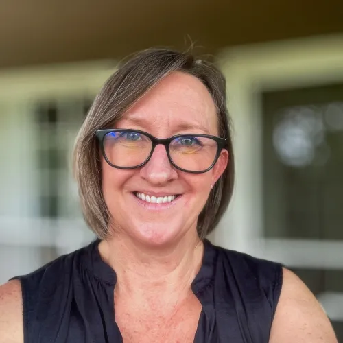 Woman with shoulderlength brown hair and glasses. Dr. Michelle Gaston headshot