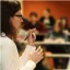 Woman lecturing to a class.