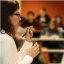 Woman lecturing to a class.