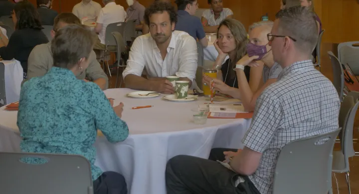 people sitting around a round table