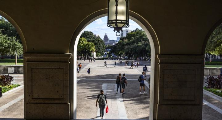 Looking at Main Mail through arch, students walking