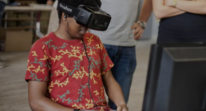 Young student engaged with extended reality device