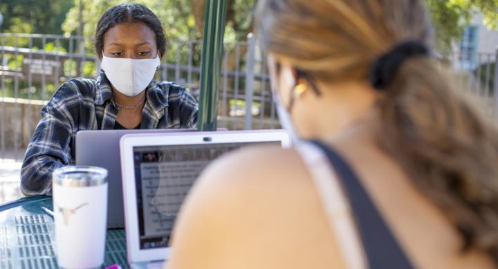 Students working outside with masks