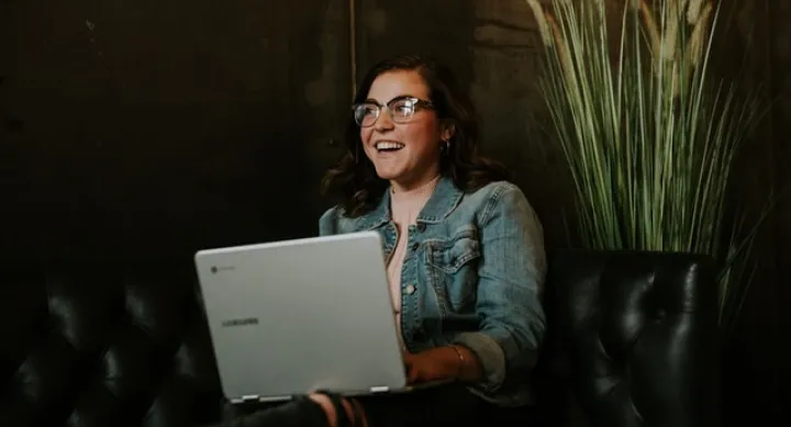 Woman smiling with laptop