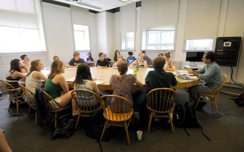 Group of Graduate students engaged in learning about teaching.